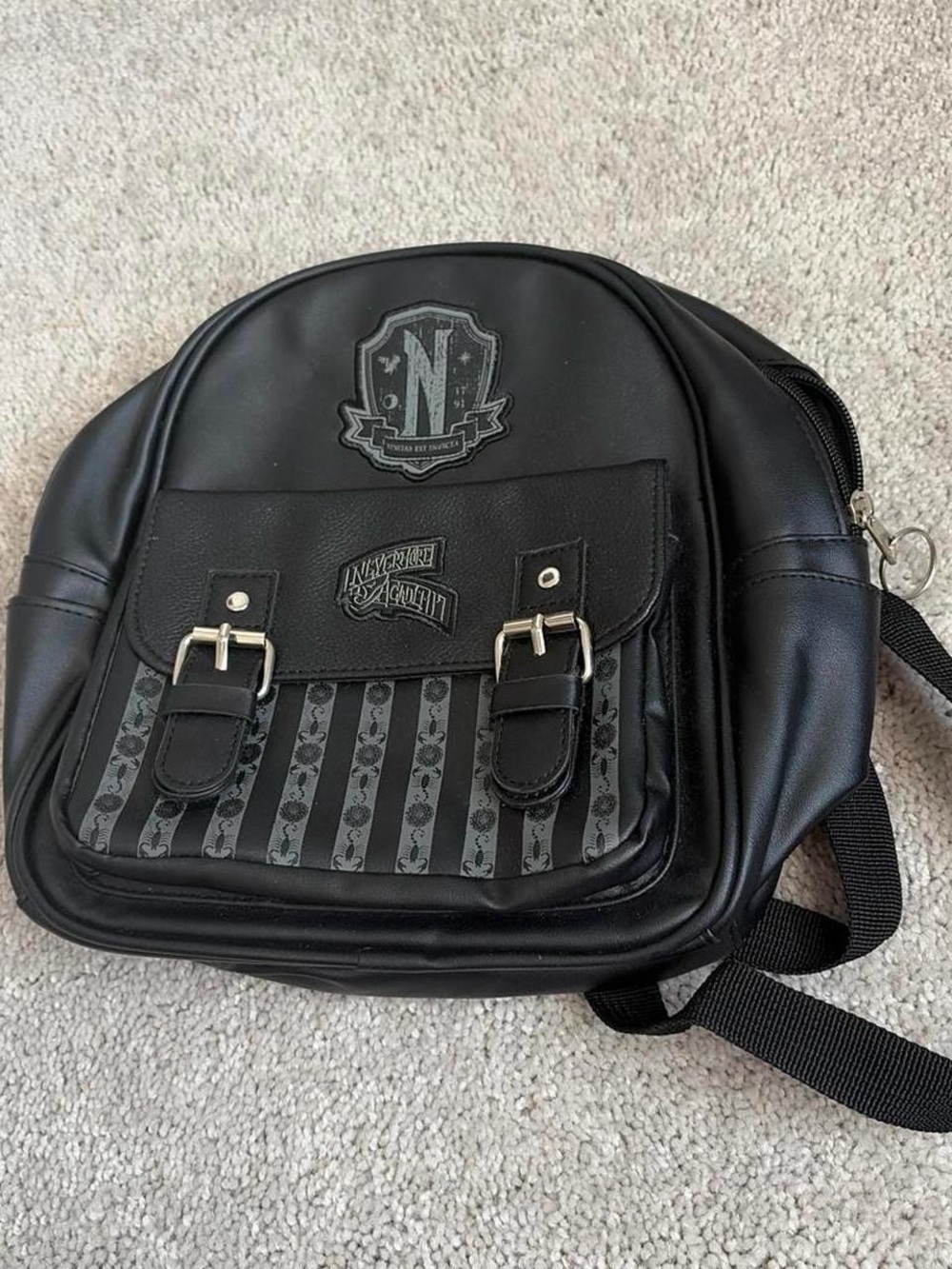 Black Mini Backpack with Crest and Stripe Accent